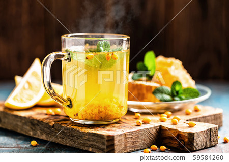 Sea buckthorn tea. Hot healing berry drink for the Sea buckthorn tea. Hot healing berry drink for the 59584260