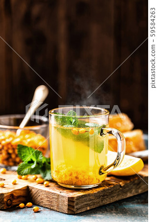 Sea buckthorn tea. Hot healing berry drink for the Sea buckthorn tea. Hot healing berry drink for the 59584263
