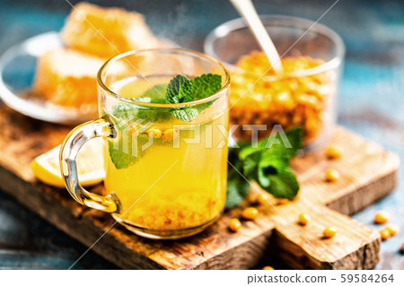 Sea buckthorn tea. Hot healing berry drink for the Sea buckthorn tea. Hot healing berry drink for the 59584264