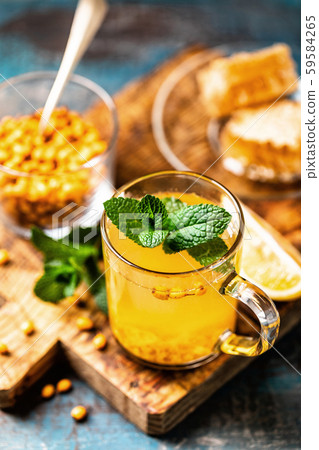 Sea buckthorn tea. Hot healing berry drink for the Sea buckthorn tea. Hot healing berry drink for the 59584265