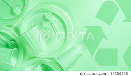 Disposable plastic tableware and recycling sign on a light background in green colors. Minimalistic 59584569