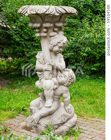 Sculpture of two angels in front of Water tower and the adjoining rotundal building of the water-and-mud baths. It wa built in Rauschen (now Svetlogorsk) in 1907-1908 by architect Otto Walter Kukkuk. Sculpture of two angels in front of Water tower and the adjoining rotundal building of the water-and-mud baths. It wa built in Rauschen (now Svetlogorsk) in 1907-1908 by architect Otto Walter Kukkuk. 59584586