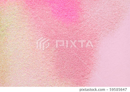 Many multi-colored spangles are scattered on a pink background. 59585647