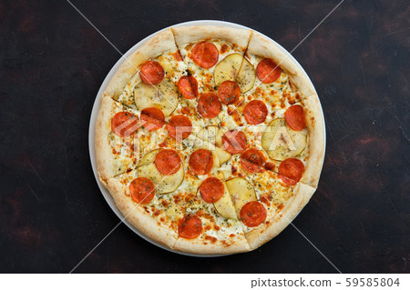Top view of pizza with sausage, pear and dor blue 59585804