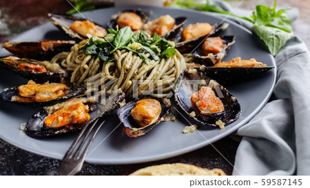 Food web banner Delicious seafood pasta. Fresh mussels and pesto pasta. Mediterranean Kitchen. Food web banner Delicious seafood pasta. Fresh mussels and pesto pasta. Mediterranean Kitchen. 59587145