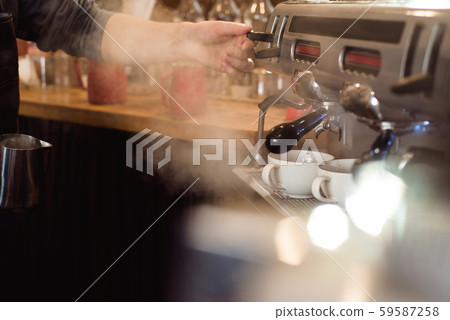 Barista make coffee latte art with espresso machine in cafe. Barista make coffee latte art with espresso machine in cafe. 59587258