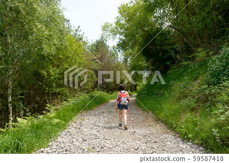 woman go hiking in the mountains woman go hiking in the mountains 59587418