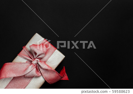 gift box on a black background, blank for postcard, poster, banner gift box on a black background, blank for postcard, poster, banner 59588623