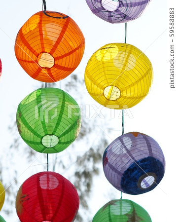 selective focus on hand painted paper ball lanterns along main entrance street of KHON KAEN university in KHONKAEN province, THAILAND on daytime showing unique decorative style LOIKRATHONG festival 59588883
