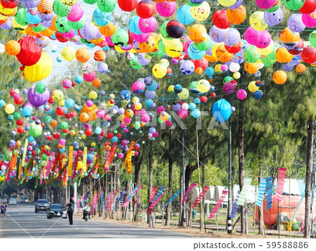 selective focus on hand painted paper ball lanterns along main entrance street of KHON KAEN university in KHONKAEN province, THAILAND on daytime showing unique decorative style LOIKRATHONG festival 59588886