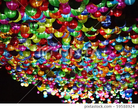 selective focus on hand painted paper ball lanterns along main entrance street of KHON KAEN university in KHONKAEN province, THAILAND on nighttime showing unique decorative style LOIKRATHONG festival 59588924