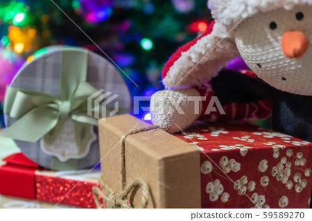 Christmas presents under the tree.Christmas gifts for whole family.Snowman Plush Toy Christmas presents under the tree.Christmas gifts for whole family.Snowman Plush Toy 59589270