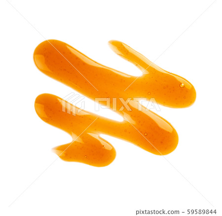 Caramel syrup drizzle isolated on white background. Splashes of sweet caramel sauce. Top view. Caramel syrup drizzle isolated on white background. Splashes of sweet caramel sauce. Top view. 59589844