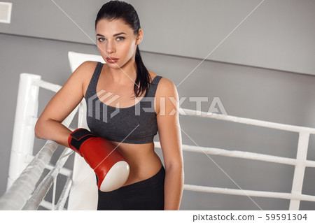 Woman in Boxing Gloves With Sports Bra Posing Boxing Style in