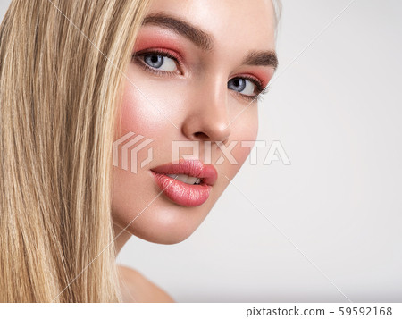 Portrait of a beautiful woman with a coral color Portrait of a beautiful woman with a coral color 59592168