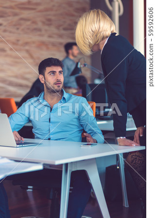 Happy business partners working on laptop. Teamwork, co-working concepts. 59592606