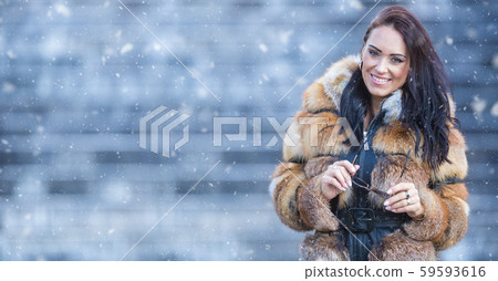 Winter portrait of attractive young woman in warm Winter portrait of attractive young woman in warm 59593616