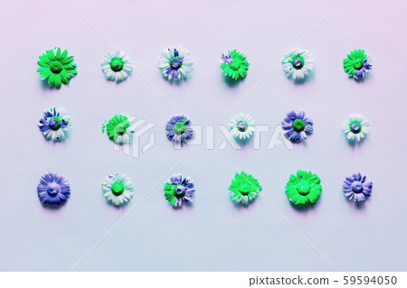 Neon light bright background with flower heads of daisies with flowing liquid paint. 59594050