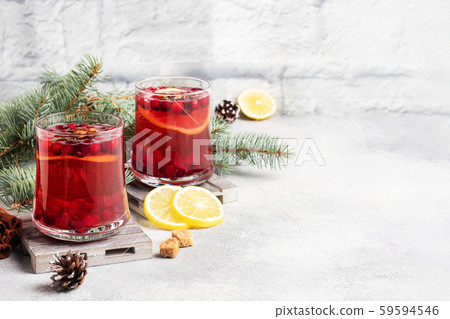 Cranberry juice with lemon and cane sugar. Winter hot drink. Copy space Cranberry juice with lemon and cane sugar. Winter hot drink. Copy space 59594546