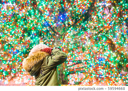 Happy girl on the background of the Rockefeller Christmas tree in New York Happy girl on the background of the Rockefeller Christmas tree in New York 59594668
