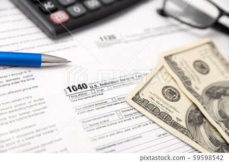 US tax form on desk composition US tax form on desk composition 59598542