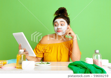 Portrait of young caucasian woman in her beauty day and skin care routine Portrait of young caucasian woman in her beauty day and skin care routine 59608259
