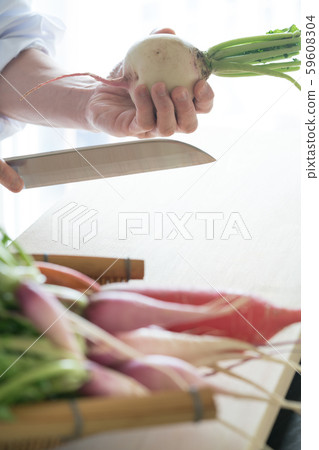 In front of the board to prepare vegetables In front of the board to prepare vegetables 59608304