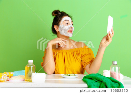 Portrait of young caucasian woman in her beauty day and skin care routine Portrait of young caucasian woman in her beauty day and skin care routine 59608350