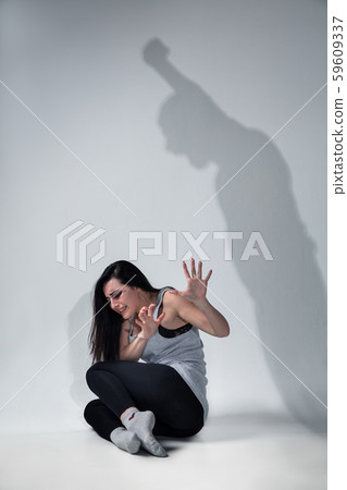 Woman being under domestic abuse and violence, concept of female rights 59609337