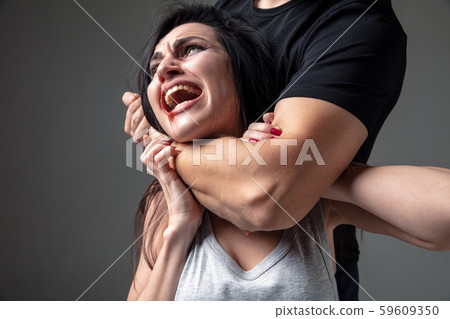 Woman being under domestic abuse and violence, concept of female rights Woman being under domestic abuse and violence, concept of female rights 59609350