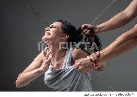 Woman being under domestic abuse and violence, concept of female rights Woman being under domestic abuse and violence, concept of female rights 59609364