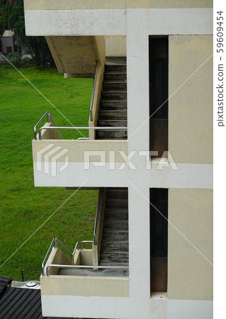 Side view of the vintage oldies apartment building with staircase Side view of the vintage oldies apartment building with staircase 59609454