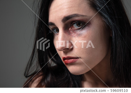 Woman in fear of domestic abuse and violence, concept of female rights Woman in fear of domestic abuse and violence, concept of female rights 59609510