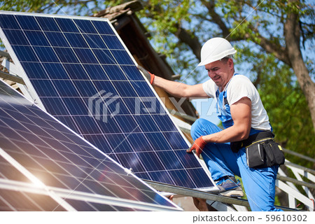 Stand-alone exterior solar panel system installation, renewable green energy generation concept. Stand-alone exterior solar panel system installation, renewable green energy generation concept. 59610302