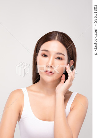 Beautiful Asian young woman holding hands smile with clean and fresh skin Happiness and cheerful with positive emotional,isolated on gray background,Beauty and Cosmetics Concept 59611802