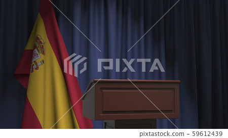 National flag of Spain and speaker podium tribune. Political event or statement related conceptual 59612439