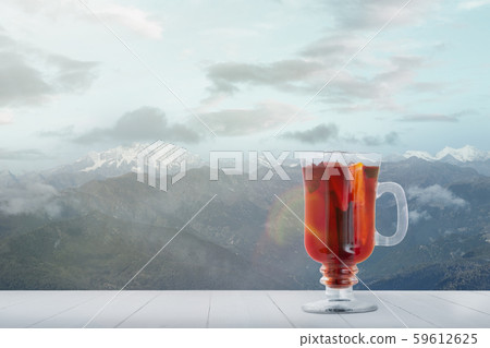 Mulled wine and landscape of mountains on background Mulled wine and landscape of mountains on background 59612625