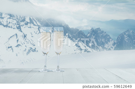 Champagne in glasses and landscape of mountains on background Champagne in glasses and landscape of mountains on background 59612649