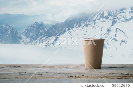 Single tea or coffee mug and landscape of mountains on background 59612670