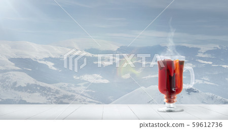 Mulled wine and landscape of mountains on background Mulled wine and landscape of mountains on background 59612736
