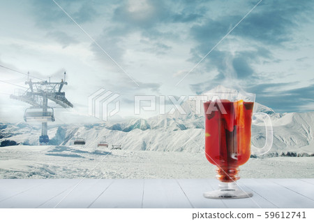 Mulled wine and landscape of mountains on background Mulled wine and landscape of mountains on background 59612741