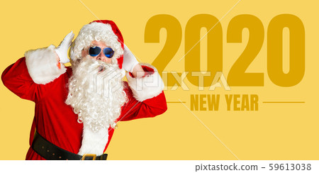 Santa Claus isolated on yellow studio background Santa Claus isolated on yellow studio background 59613038