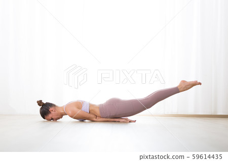 Portrait of gorgeous active sporty young woman practicing yoga in studio. Beautiful girl practice 59614435