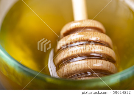 honey with a spoon close-up honey with a spoon close-up 59614832