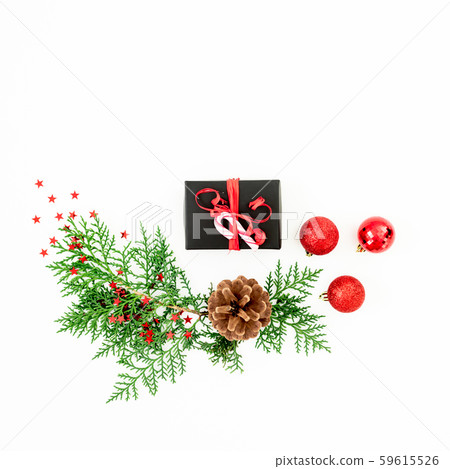 Merry Christmas composition with branches, gift and balls with confetti on white. Flat lay 59615526