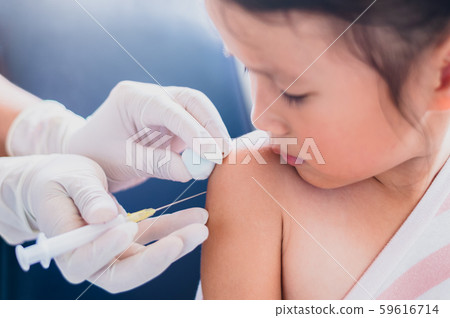 Little child having Injection,Close-up Doctor injecting vaccination to arm of asian little girl 59616714