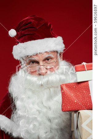 Santa giving gift boxes 59616897