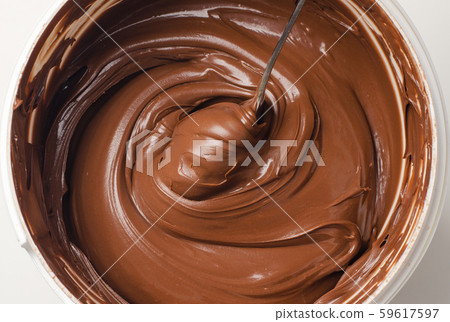 Background of chocolate paste with spoon Background of chocolate paste with spoon 59617597