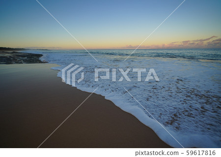 Sunrise at the sandy beach in Molokai Hawaii 59617816