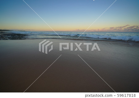 Sunrise at the sandy beach in Molokai Hawaii 59617818